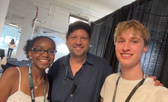 Evan Morris with a fellow champion and an organizer at the National STEM Festival